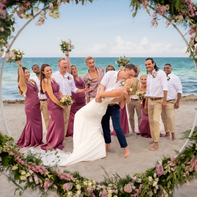 wedding photography space coast portrait session beach bride and groom dip kiss