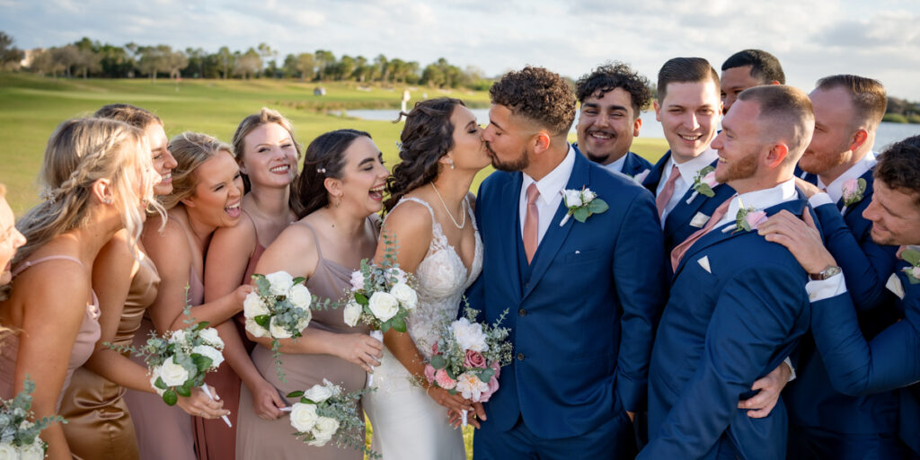 wedding photography space coast portrait session golf course bride and groom kiss bridal party