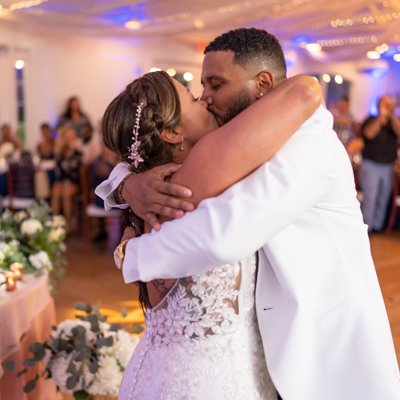 wedding photography space coast reception entrance bride and groom kiss